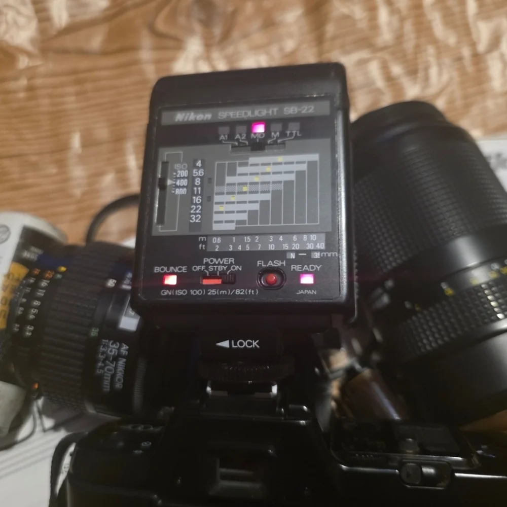Nikon N4004 AF camera w/ 2 lenses, Flash, Film and Accessories